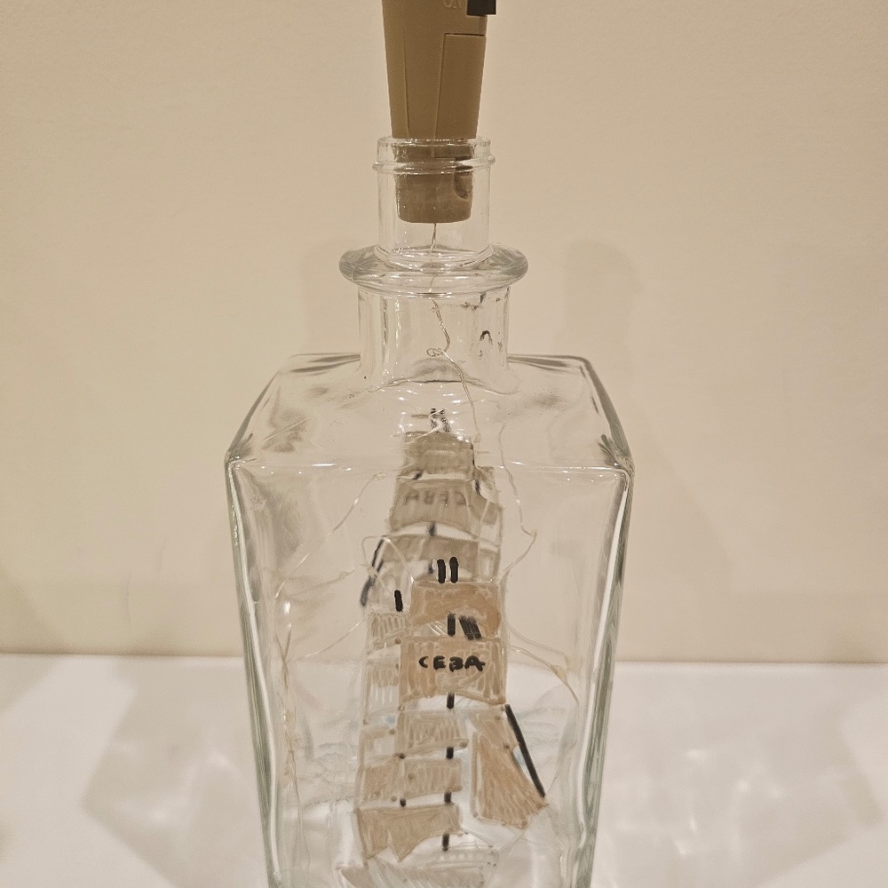 Liquor bottle with cork lights